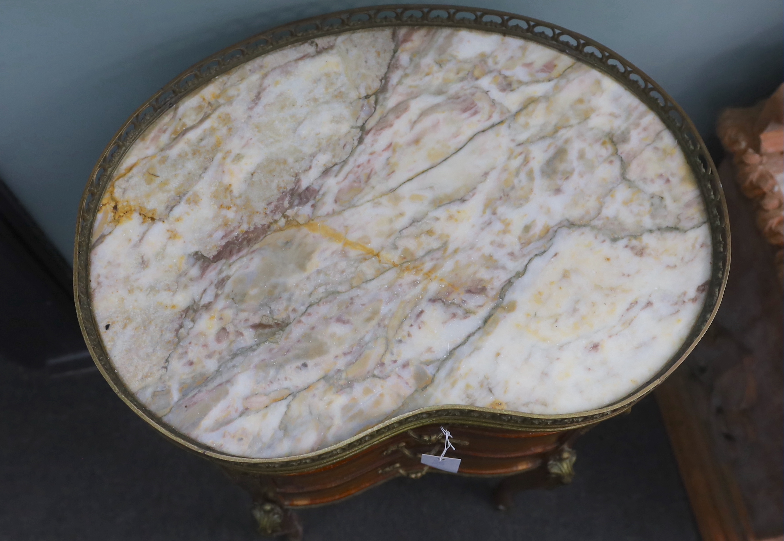 A Louis XVI style marble topped kidney shaped kingwood three drawer side table, width 52cm, depth 38cm, height 73cm